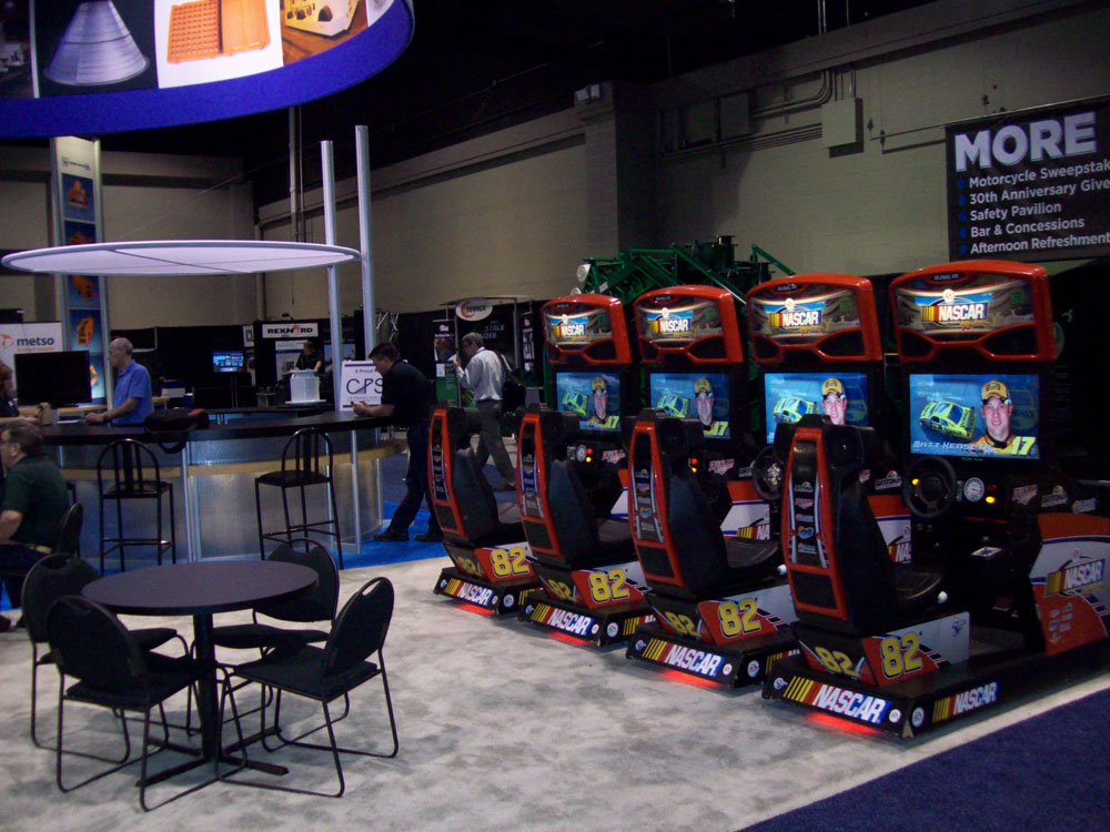 photo of 4 linked EA Nascar racing simulators